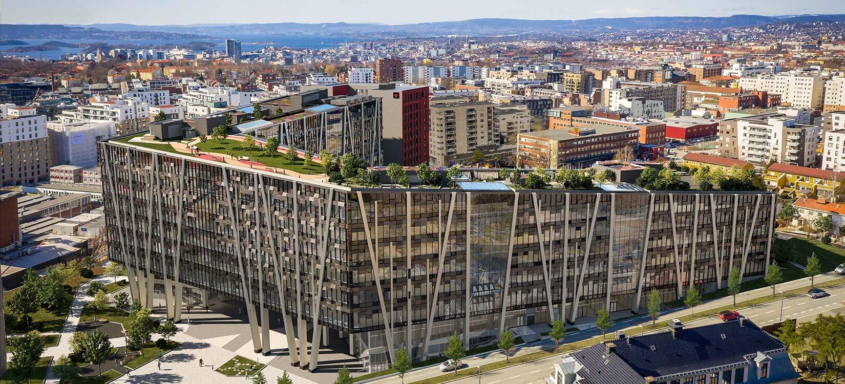 Et oversiktsbilde i fugleperspektiv over et stort kontorbygg med en frodig park på taket.