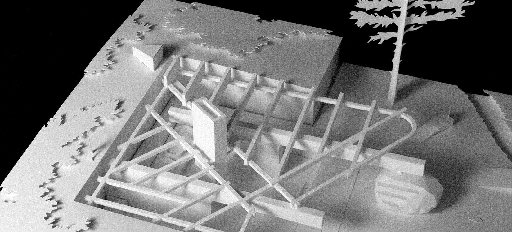 Nærbilde av arkitekturmodell med paviljonger og åpne rom i et hageanlegg.