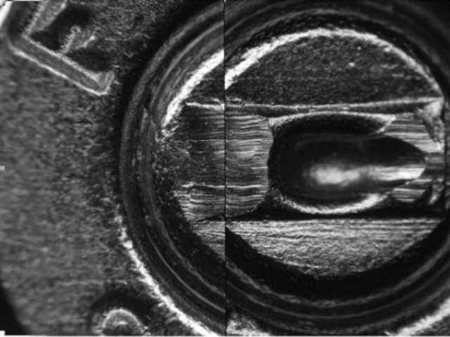 Two test-fired cartridge casing being compared under a comparison microscope. Matching striations between the two can be seen.