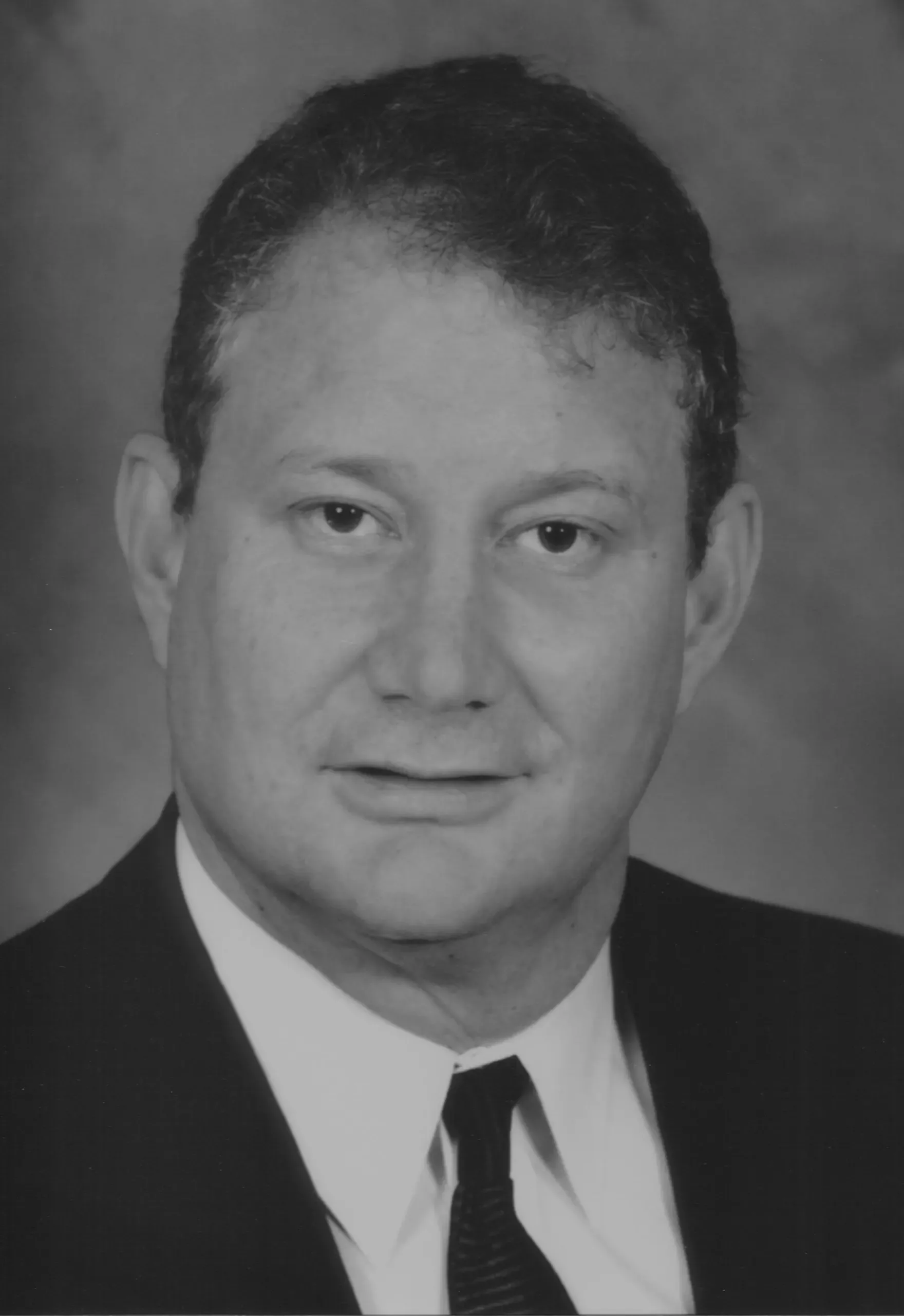 Judge G. Murray Snow, a white man in a suit