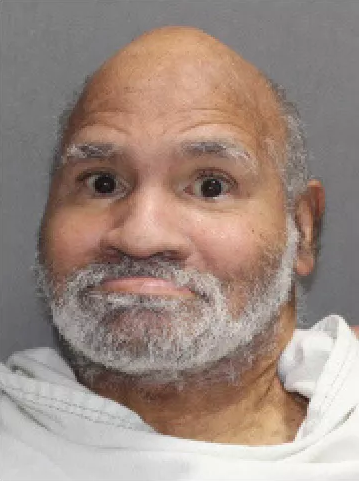 Clarence Jordan, an elderly Black man, balding with a gray beard.