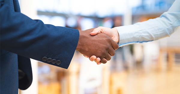 Diverse business handshake