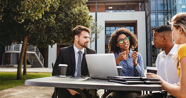 Diverse friends talking outside