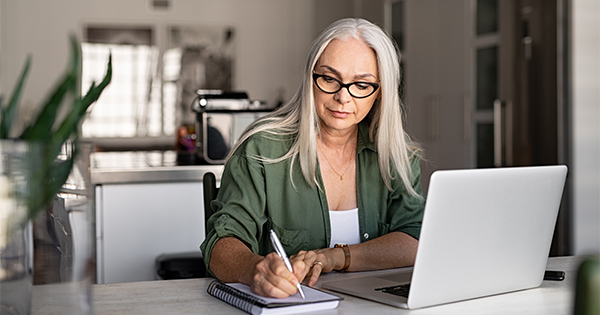 Older women signing paper