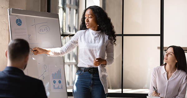 Woman presenting graphs