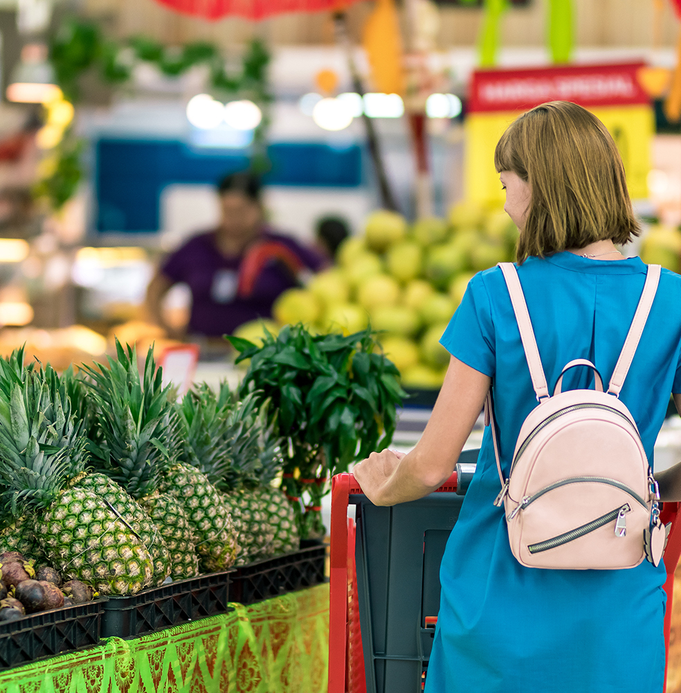 Woman standing beside pineapple fruits 2292919 2