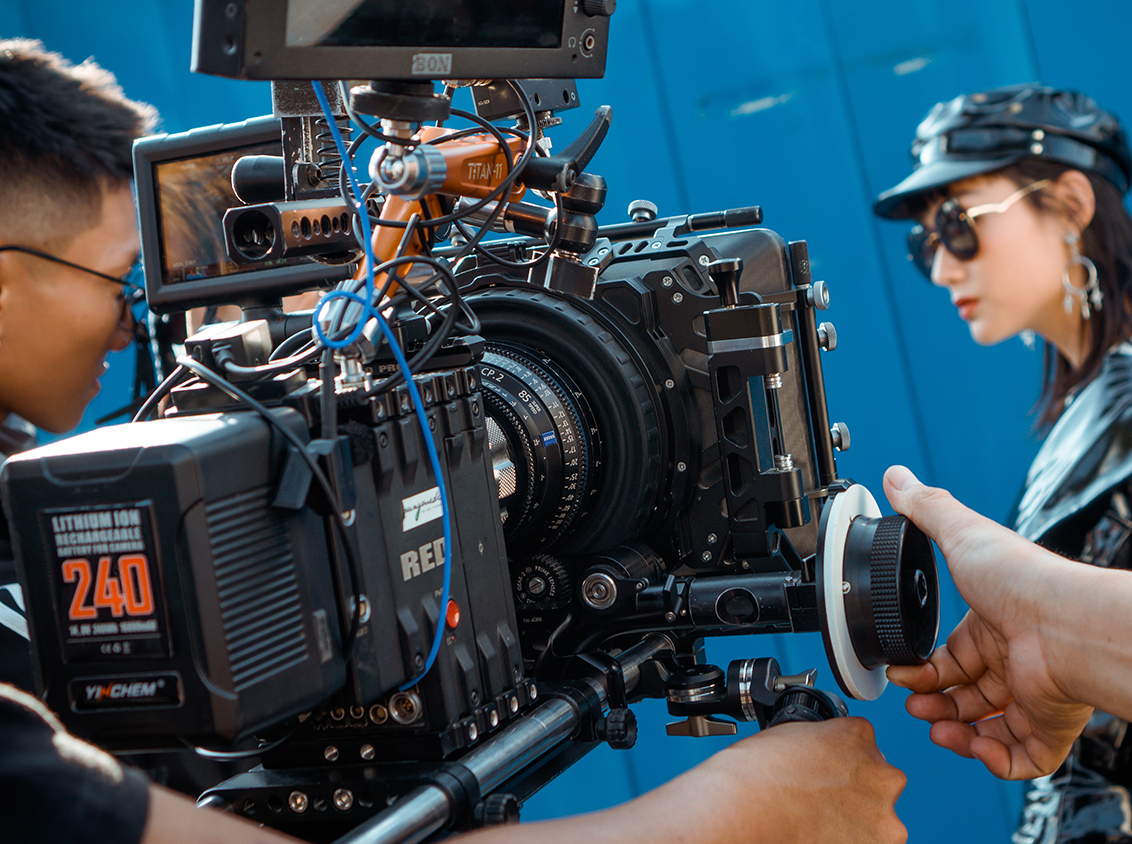 Photo of men holding camera 3062545