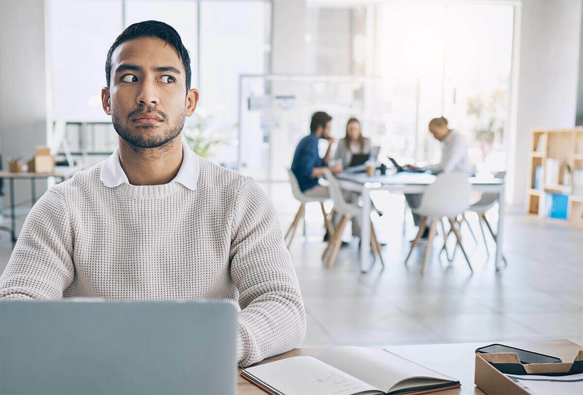 suspicious worker listening to co-workers in a breakroom