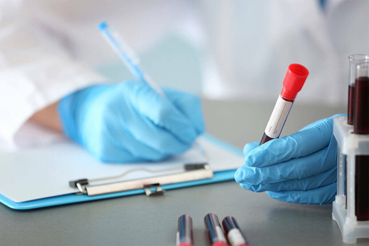 medical technician recording blood titer results
