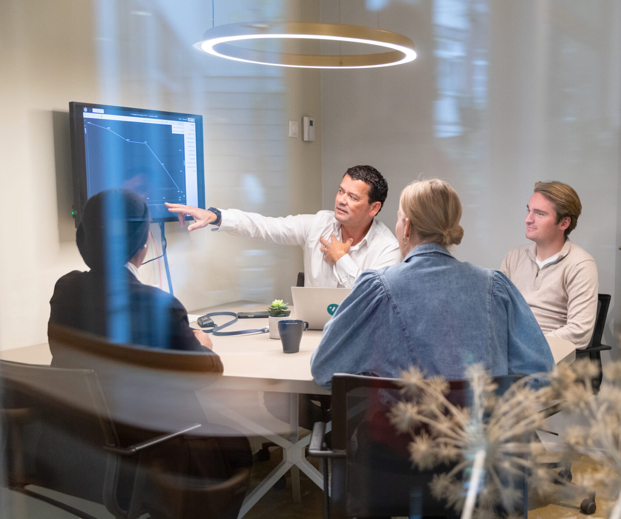 Building the success of your organization -man giving presentation in a conference room