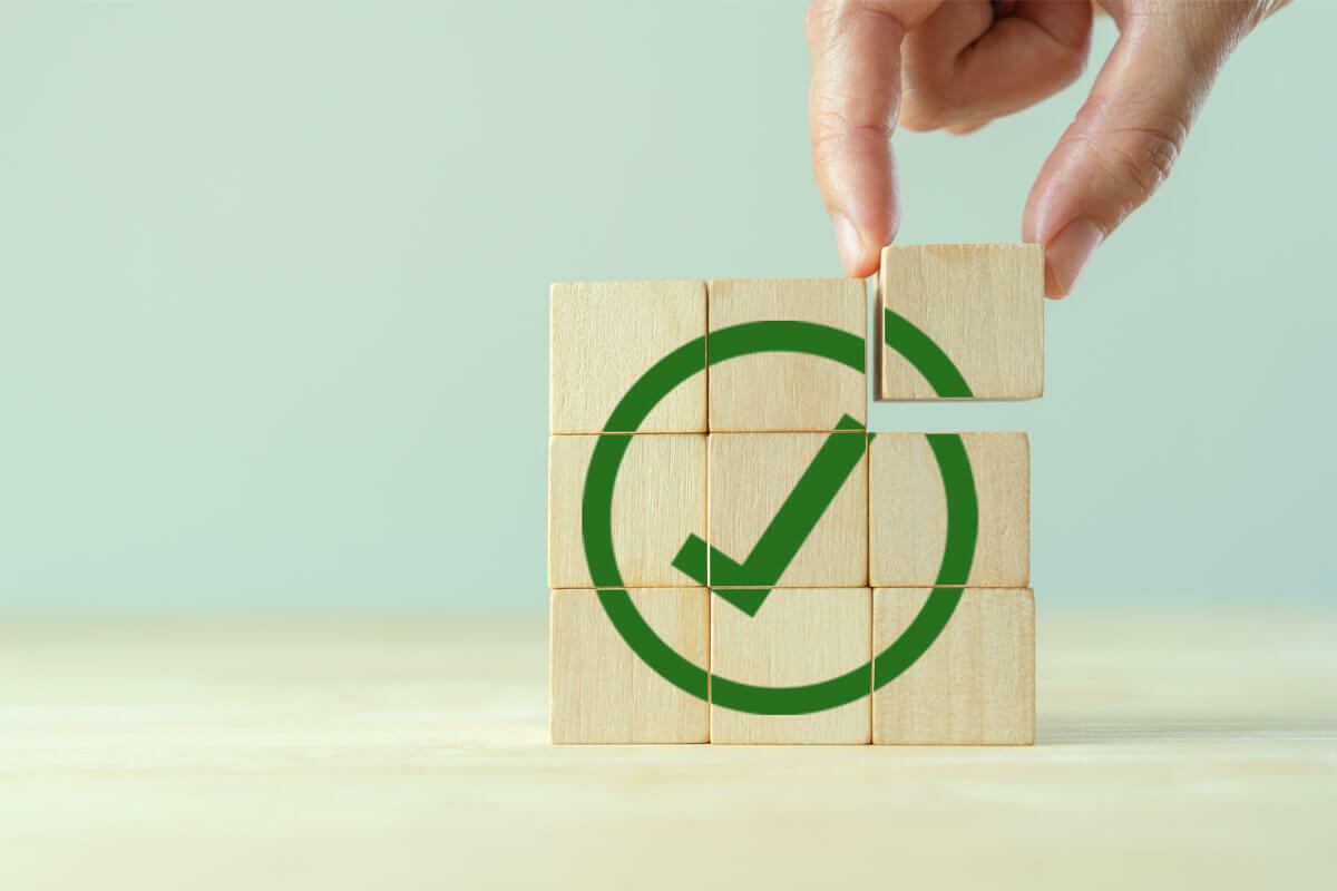 legal compliance wooden block check mark