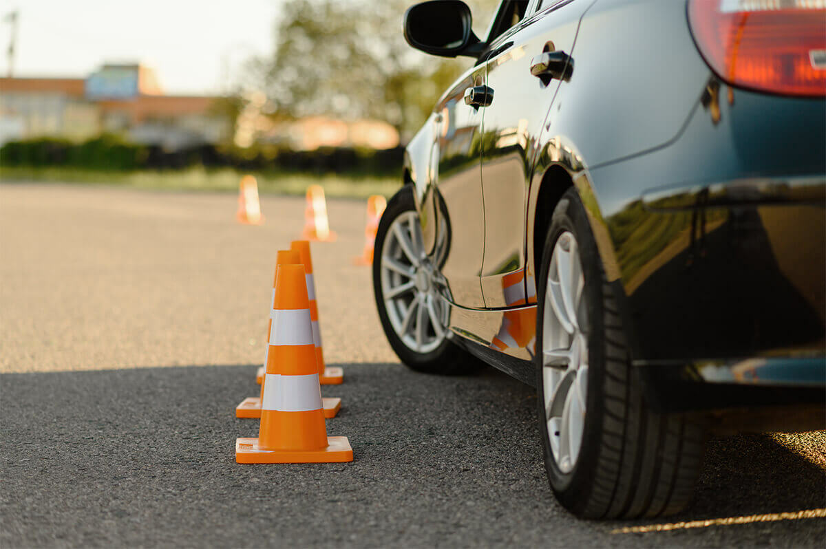 driving test car with safety cones