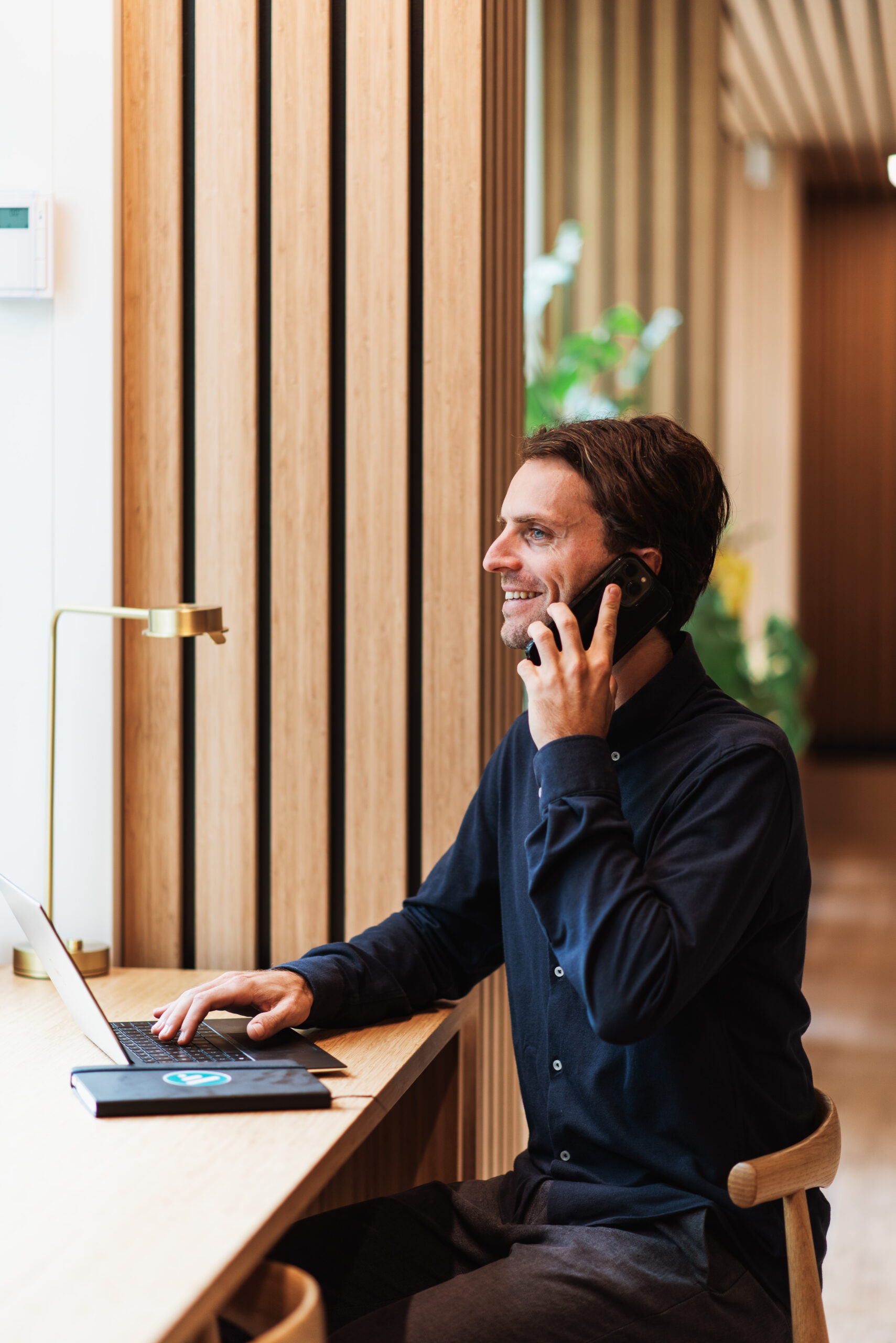 man smiling talking on his cellphone
