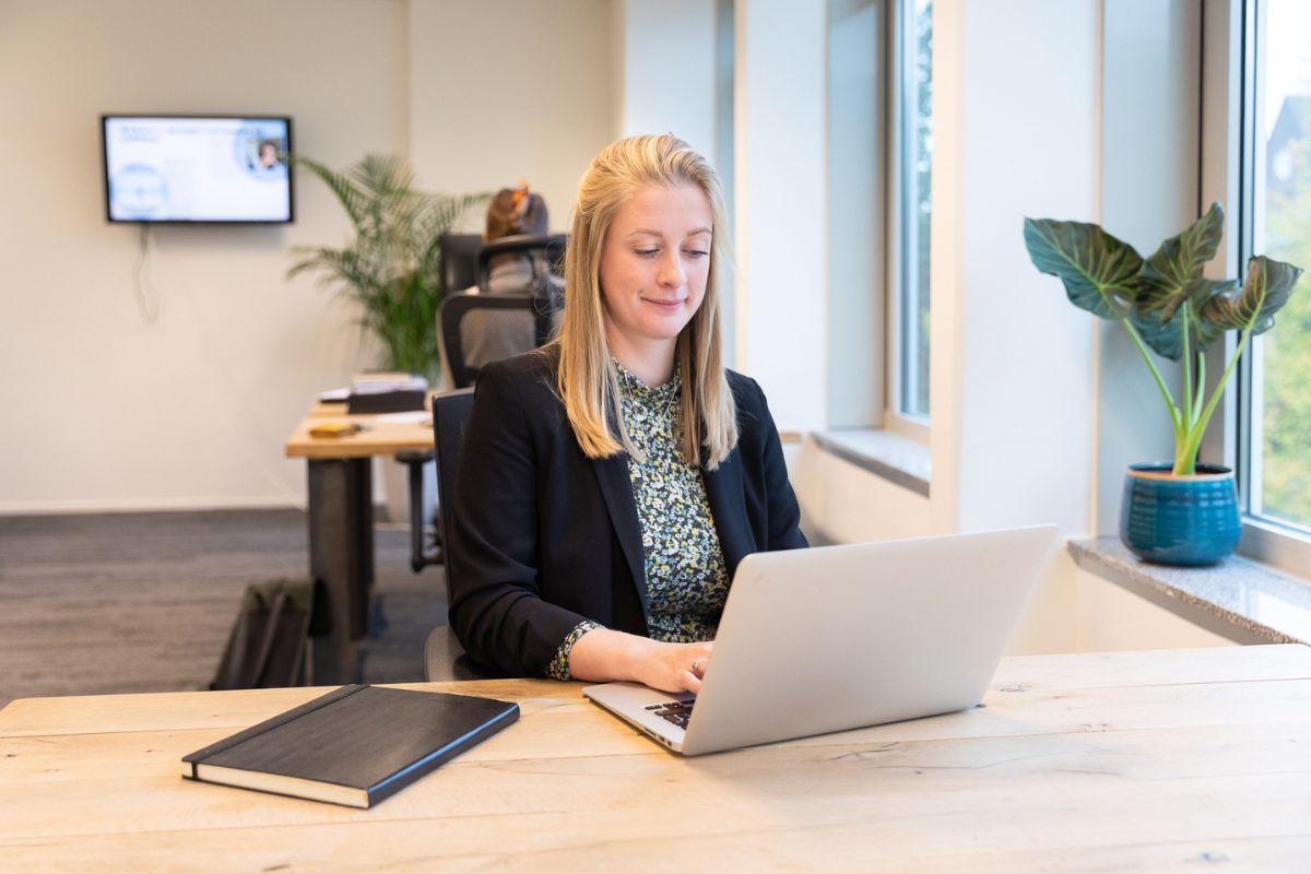 Woman reading on her computer about background checks