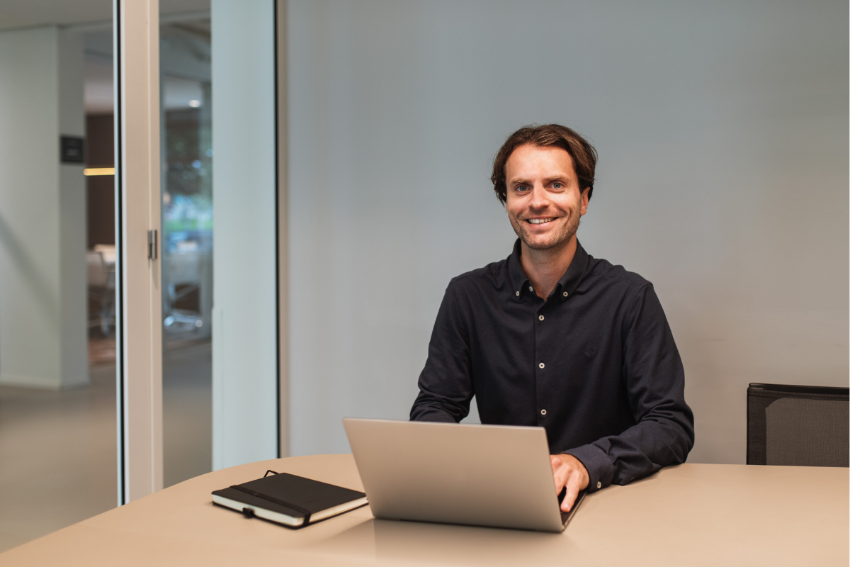 A smiling man reading about background checks