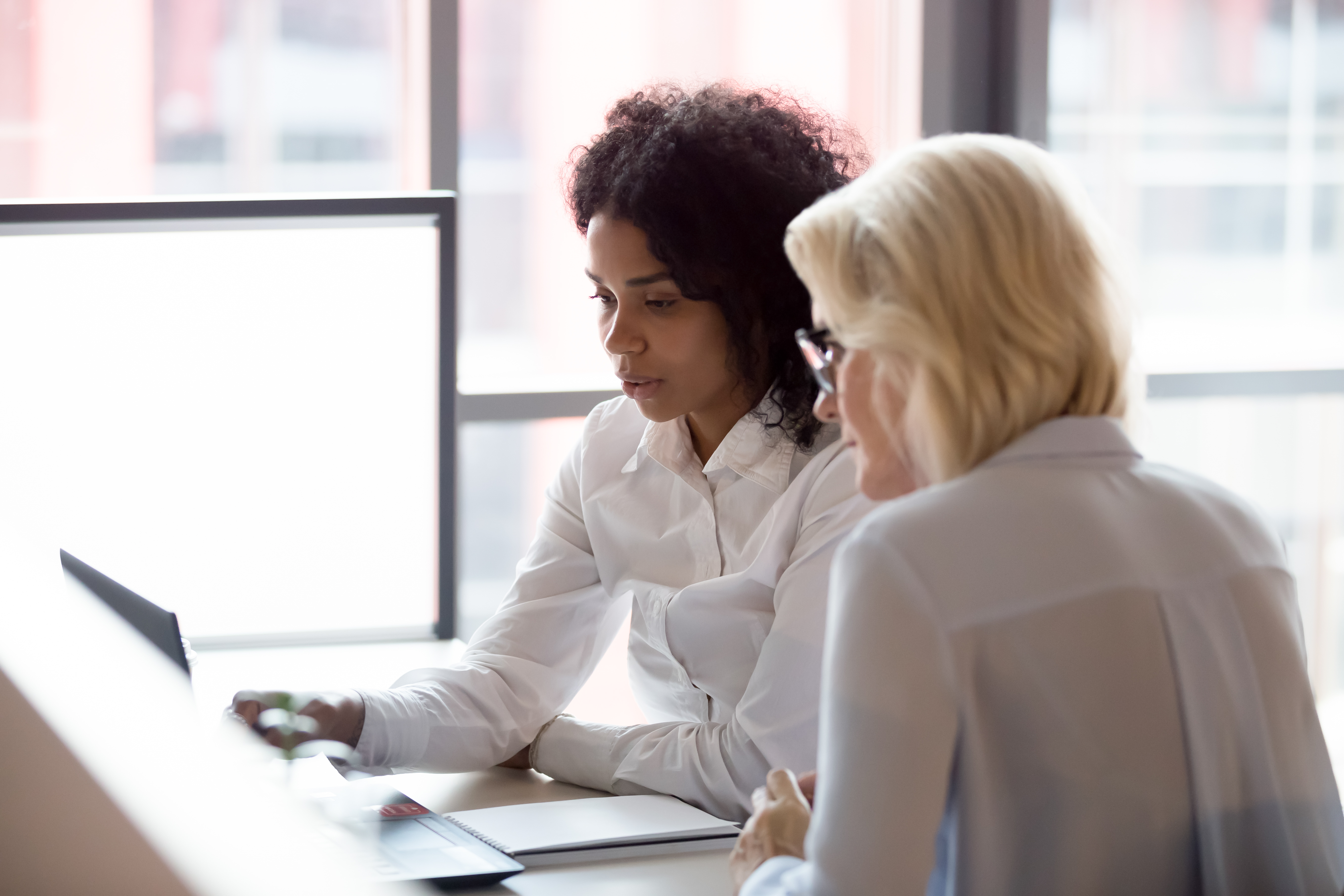 Two women in an office enviroment