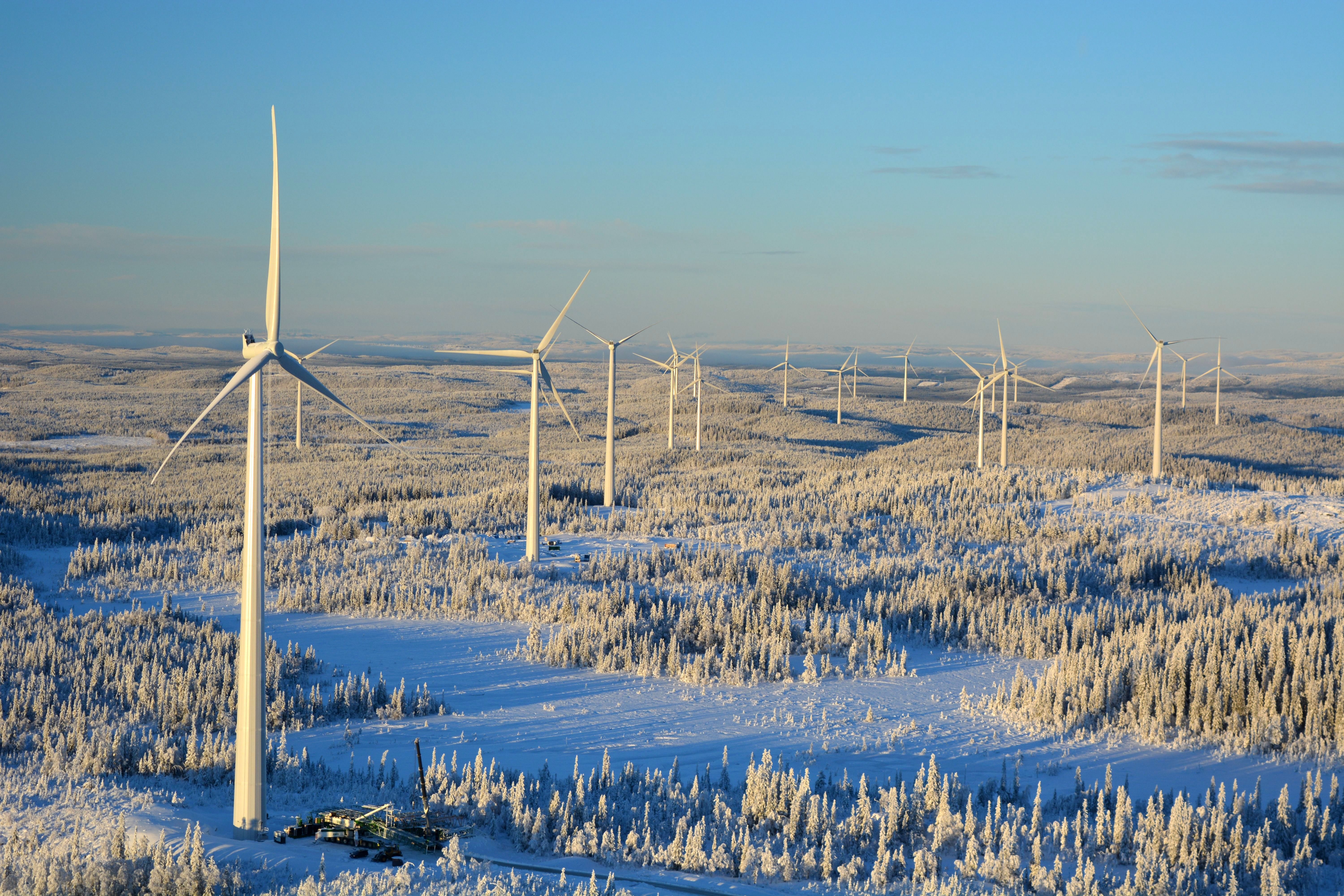 Wind turbines in a snowy landscape.