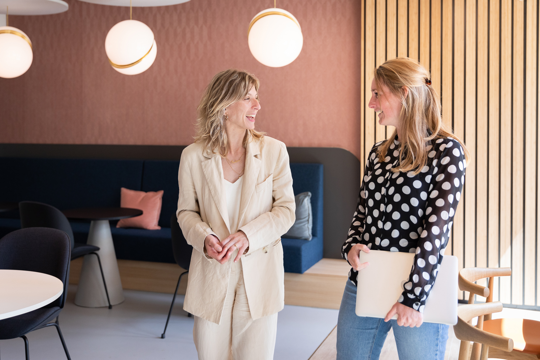 Two women talking to each other in an office