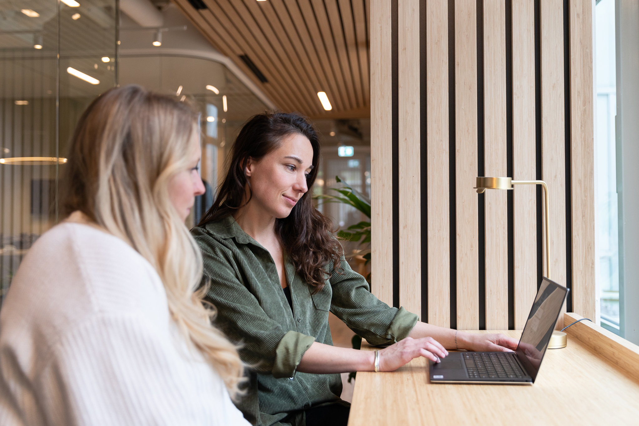 Two women in an office enviroment