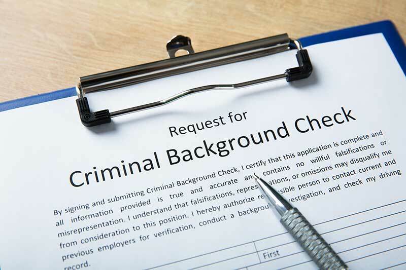 Form on a clipboard with the title: Criminal Background Check