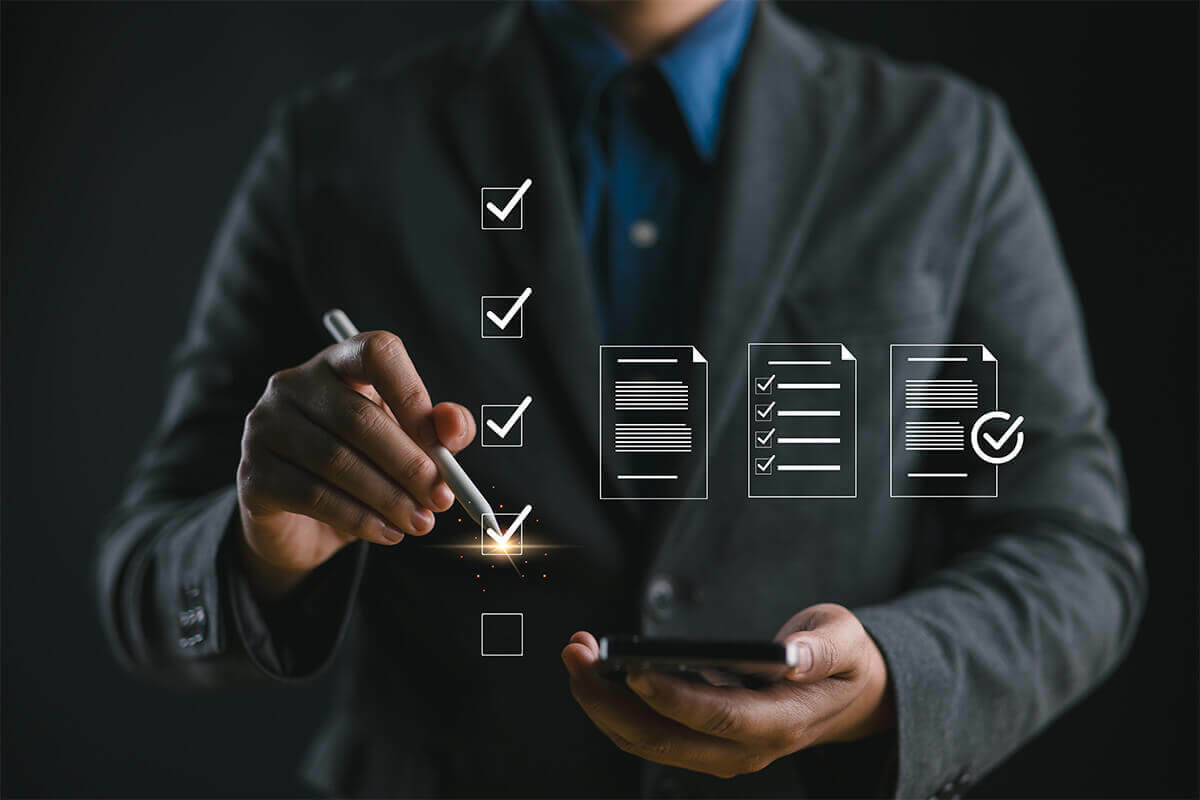 businessman checking off boxes