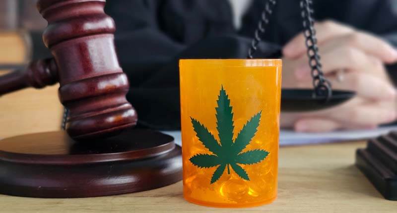 Judge discusses cannabis law reform with gavel and marijuana container