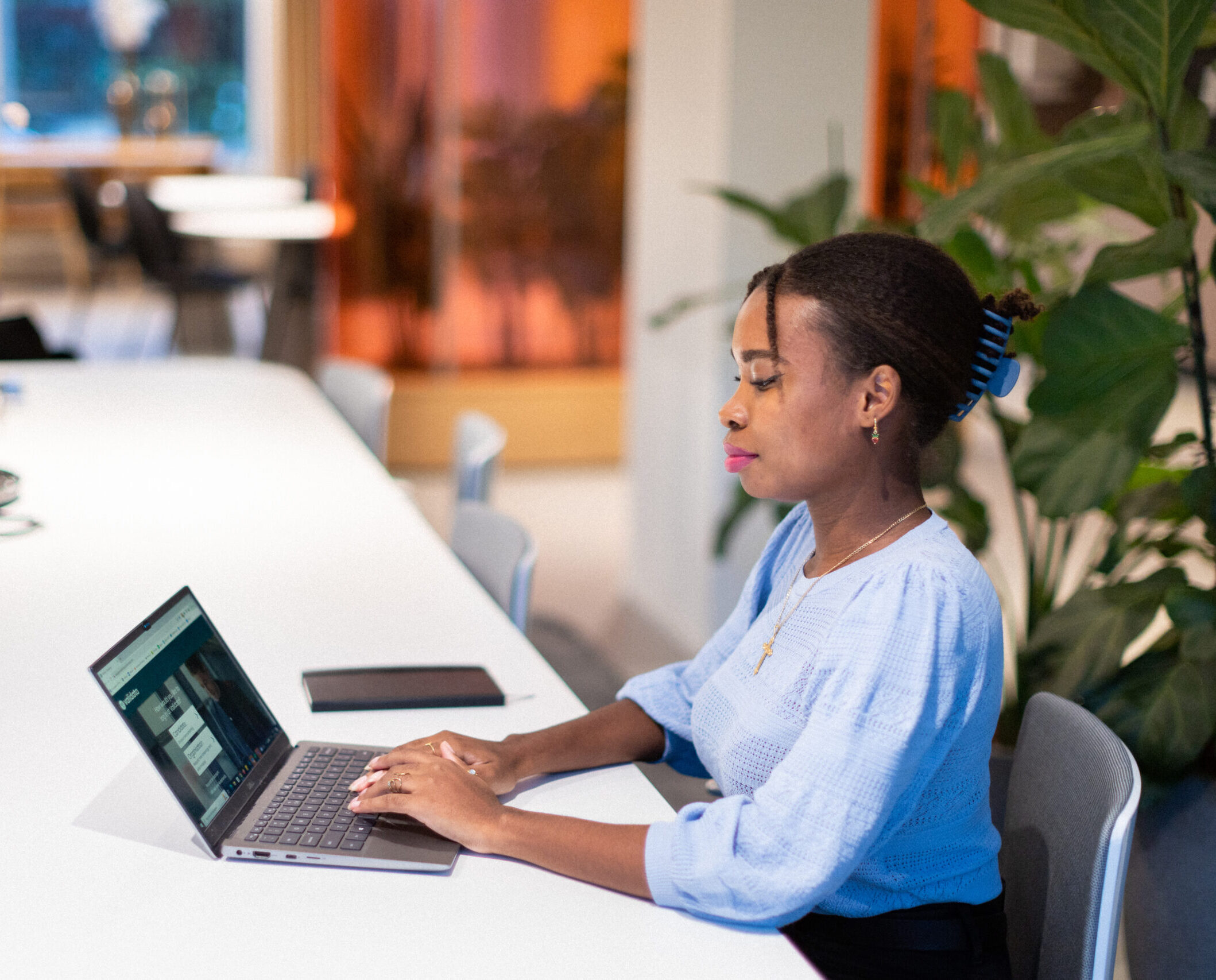 employee working on her laptop in the office