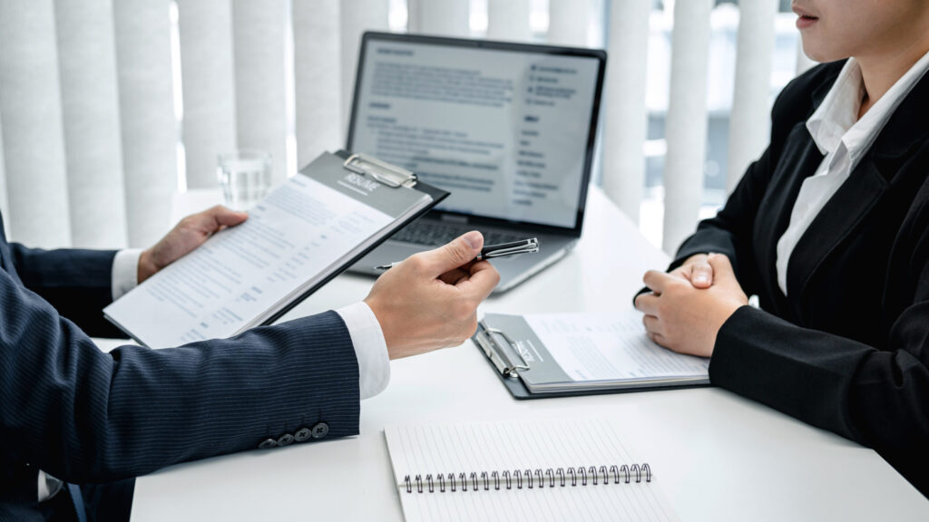 HR reviewing resume with job candidate