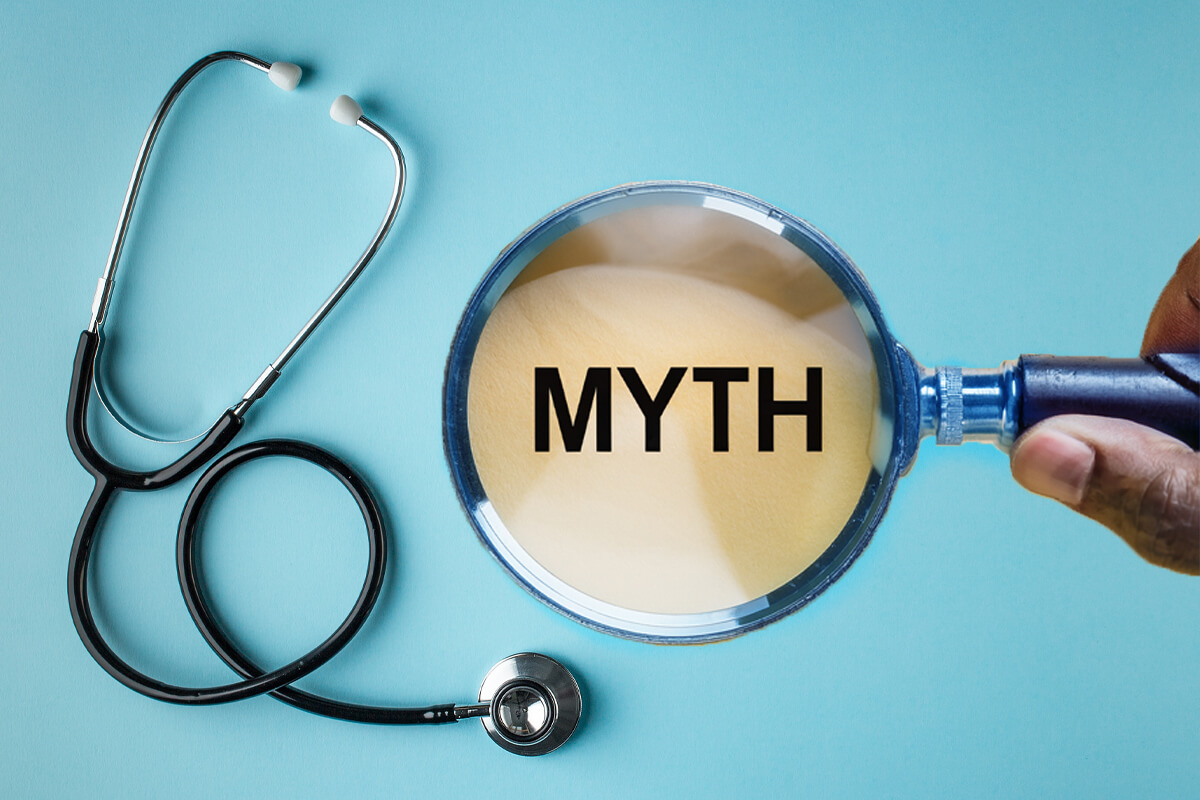 magnifying glass over the word myth and stethoscope