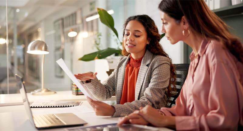 women team and talking with paperwork for policy review