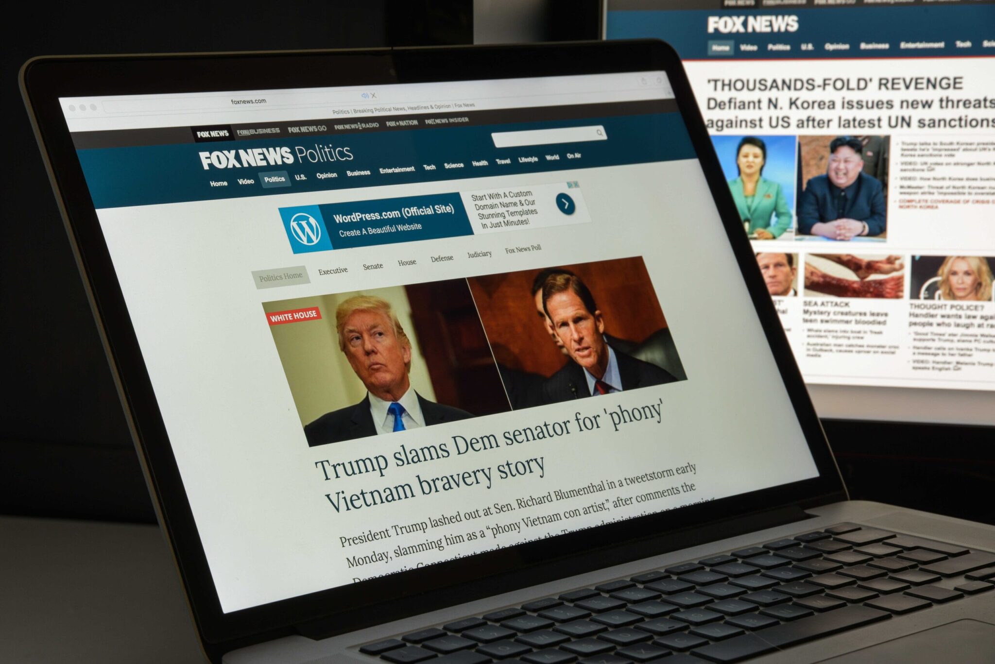 adverse media check results on laptop screen