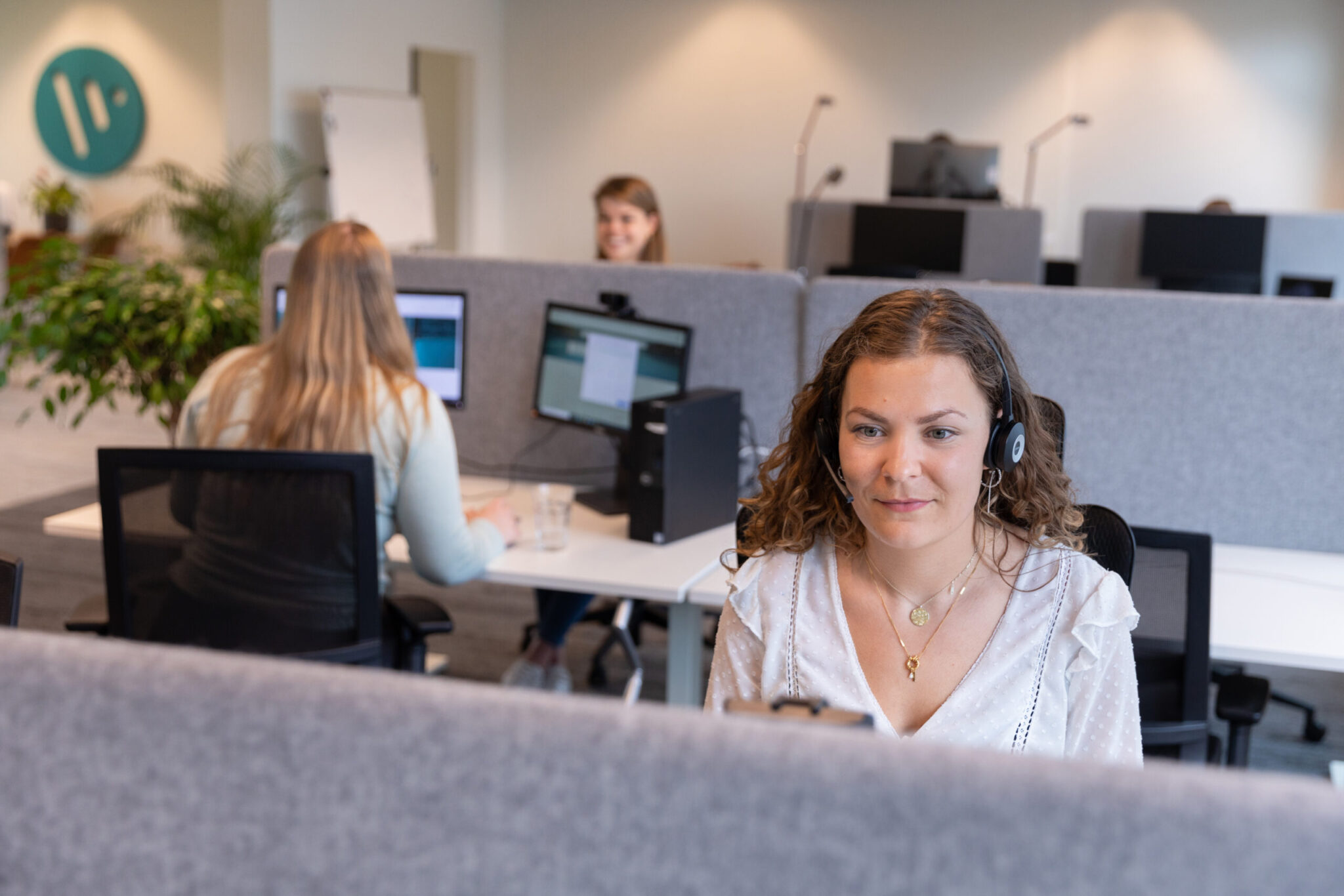 customer service representatives working in the office