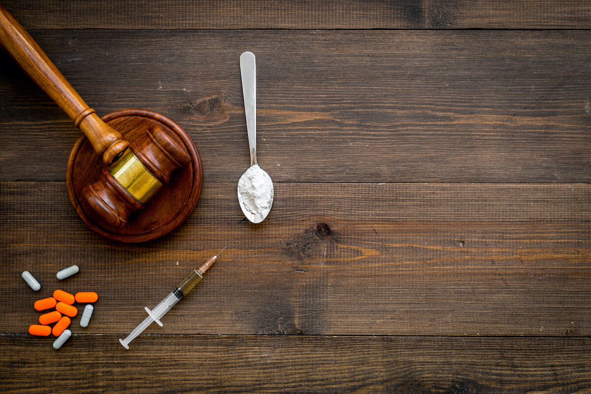 legal gavel and drugs pills needle injection