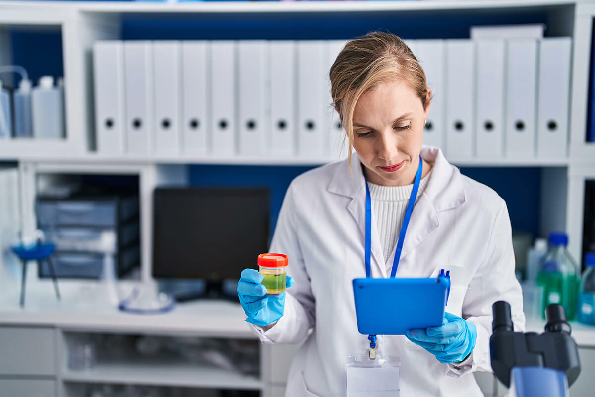woman analyzing drug test urine sample