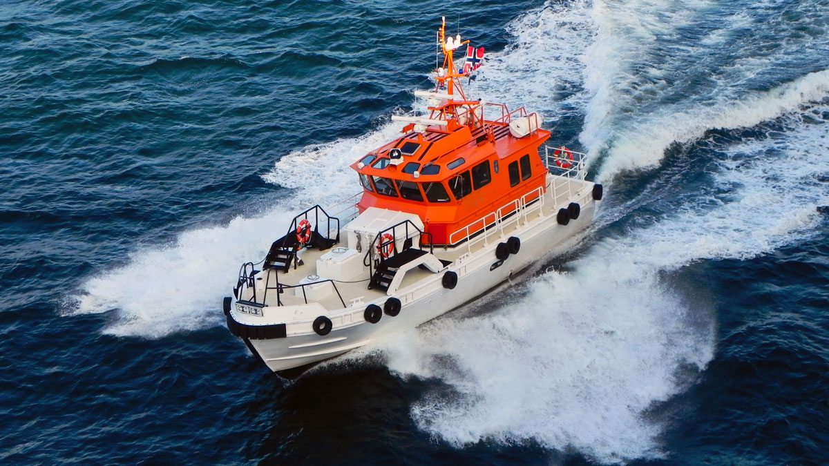 A Coast Guard boat racing through the waves