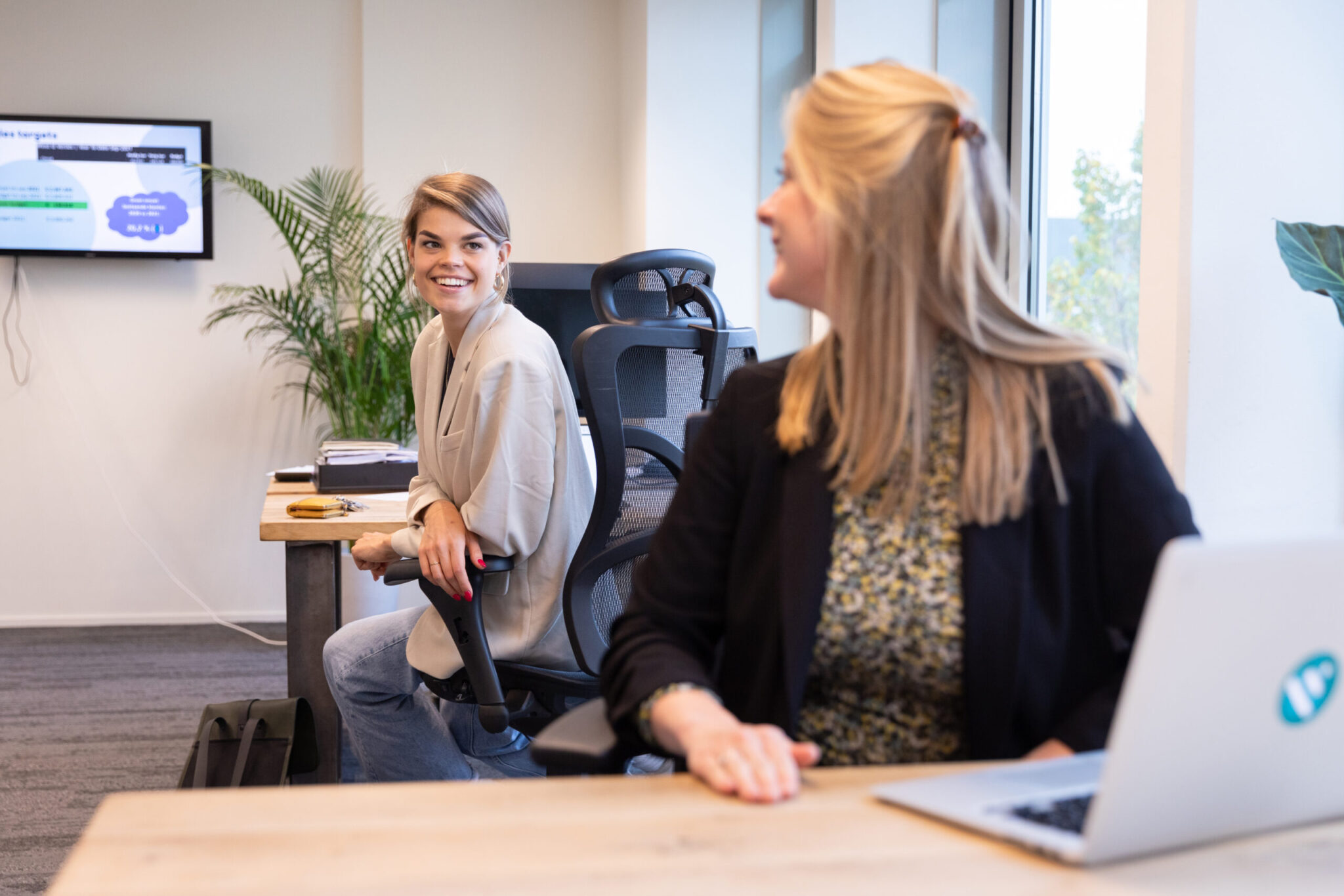 Två female staff works at DISA