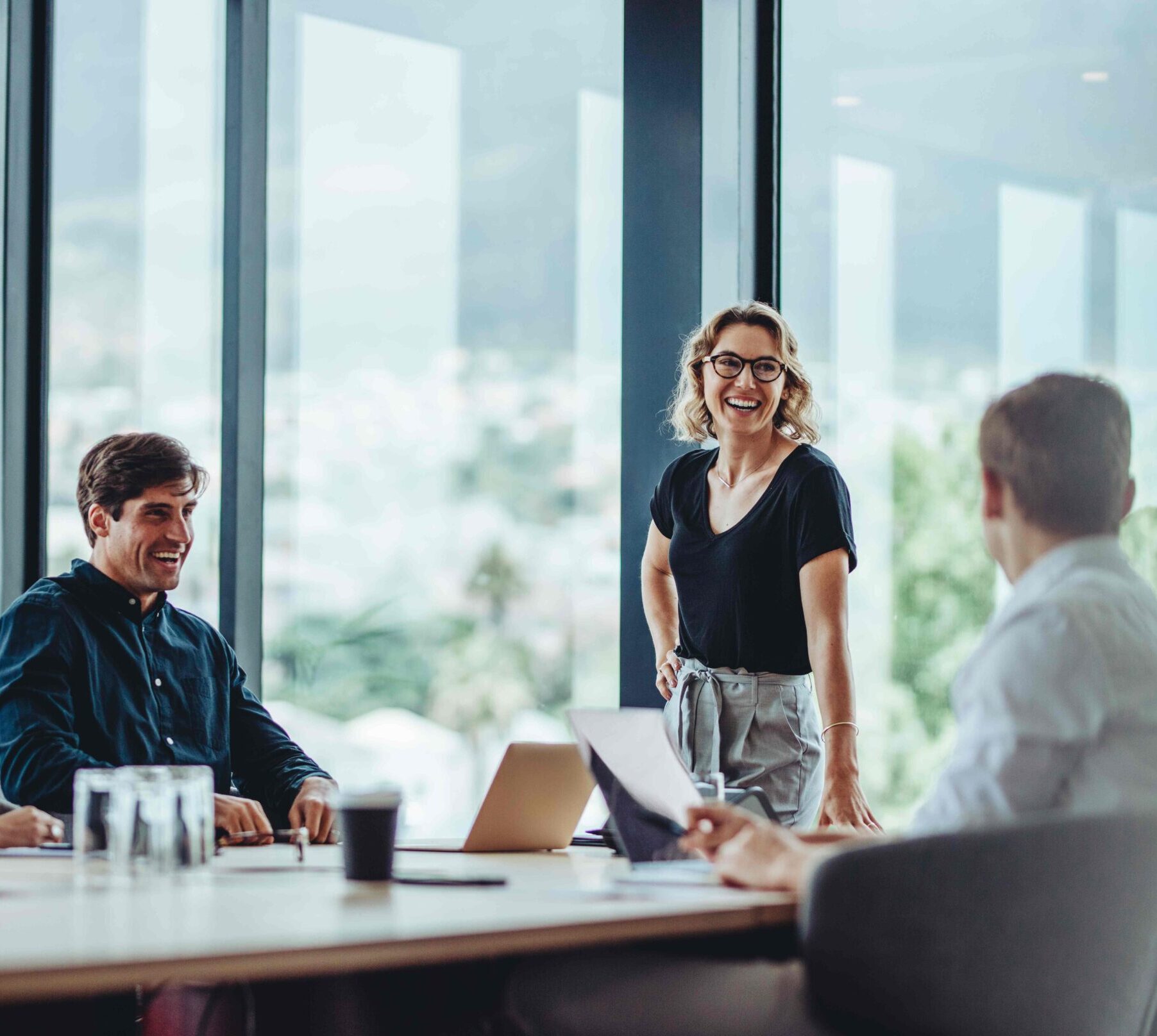 People meeting in board room and smiling