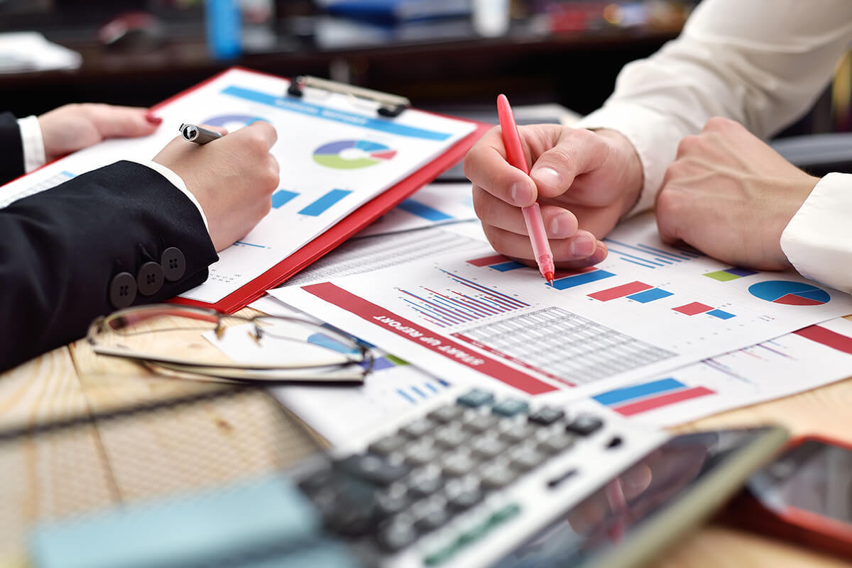 Group of people reviewing document in preparation for an audit
