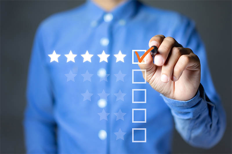 business professional marking off a checklist 5 star rating