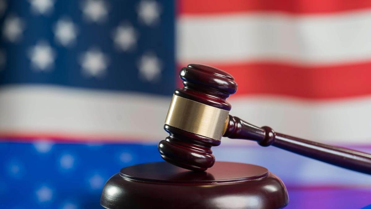 law gavel in front of the American flag