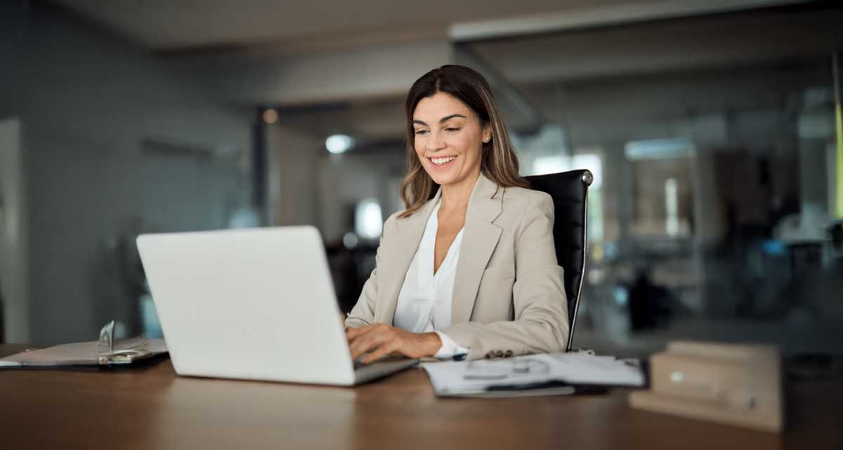 cheerful businesswoman working at her desk