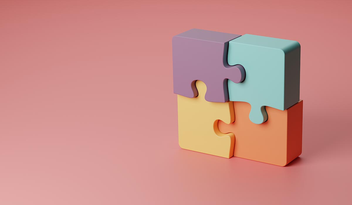 four puzzle pieces making a block