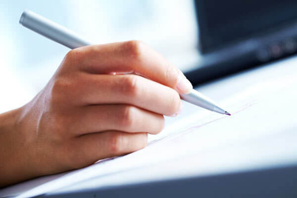 close up image of handwriting with red ink