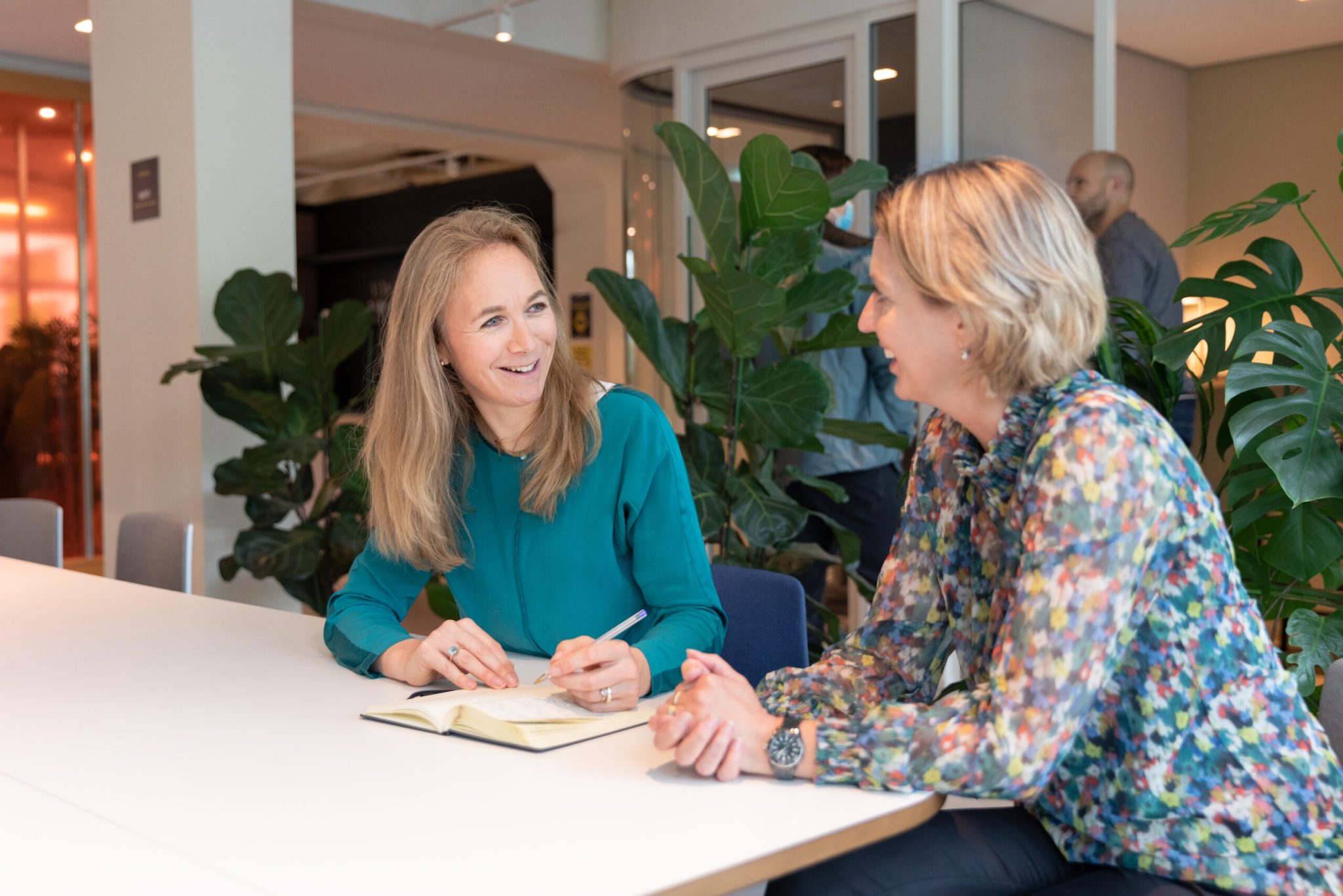 Two women talking about In-employment Screening