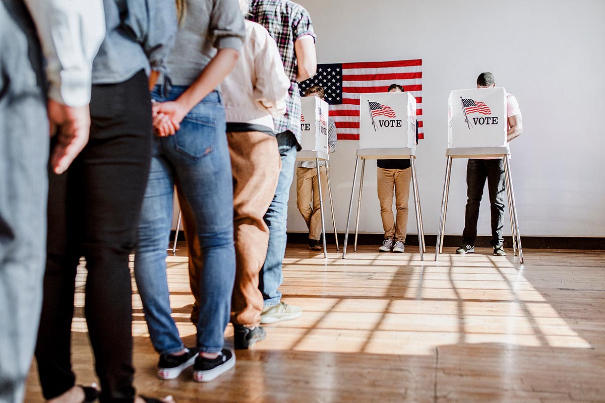 line of people waiting to vote voting booth