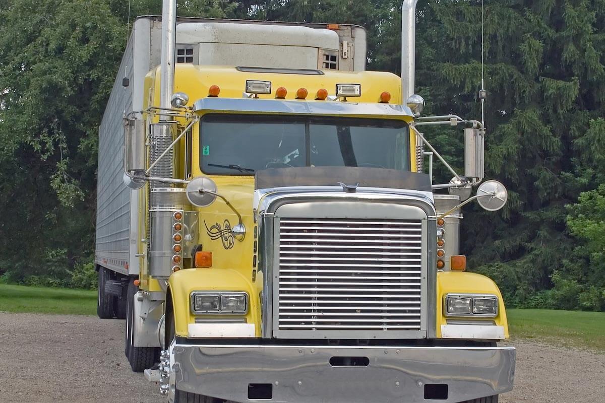 yellow big rig with white trailer