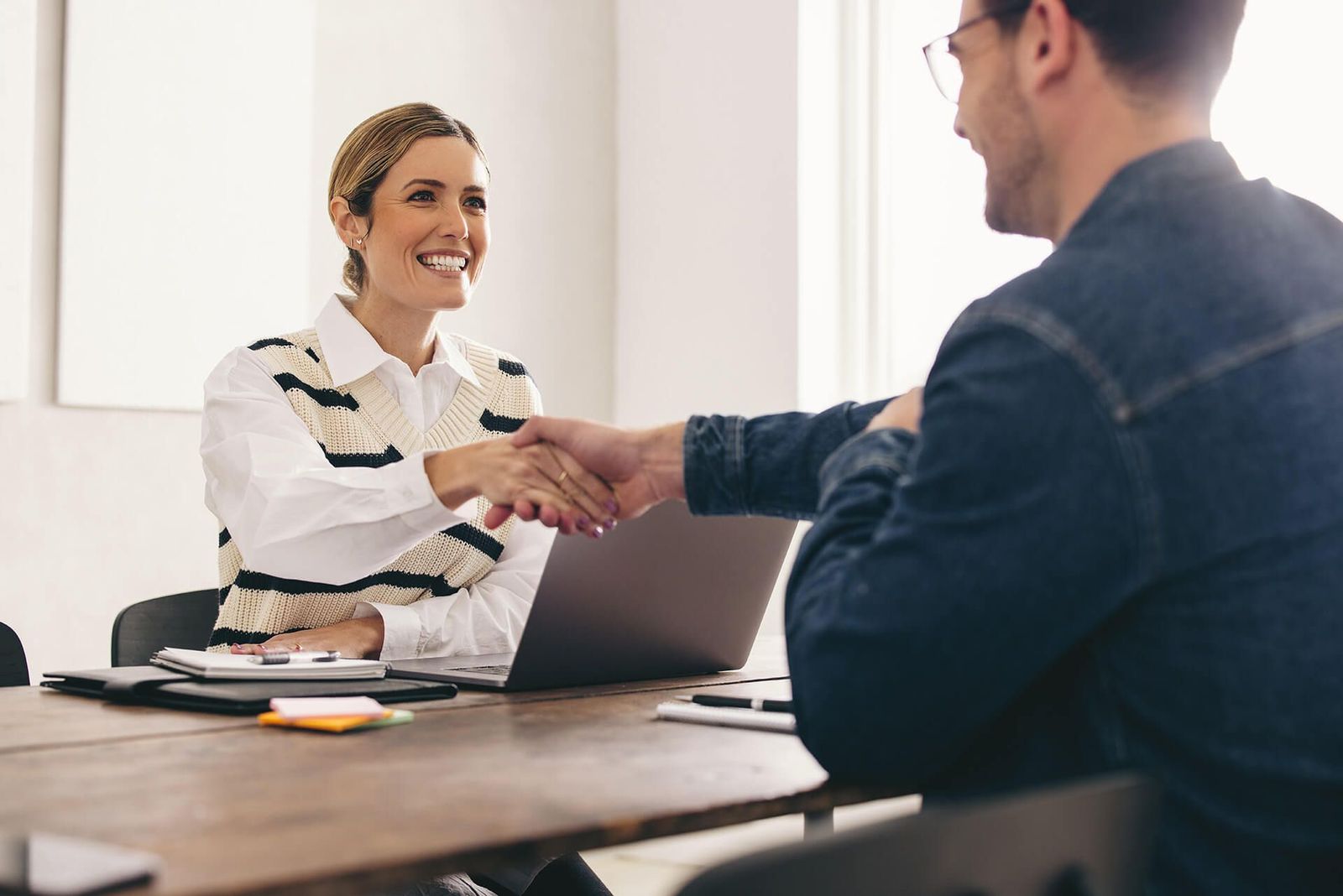 Woman and man shaking hands