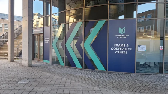 Entrance to Nottingham One Unit D, showing the navy and teal vinyl arrows