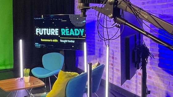 A picture of our media centre with a green screen and sound boom.