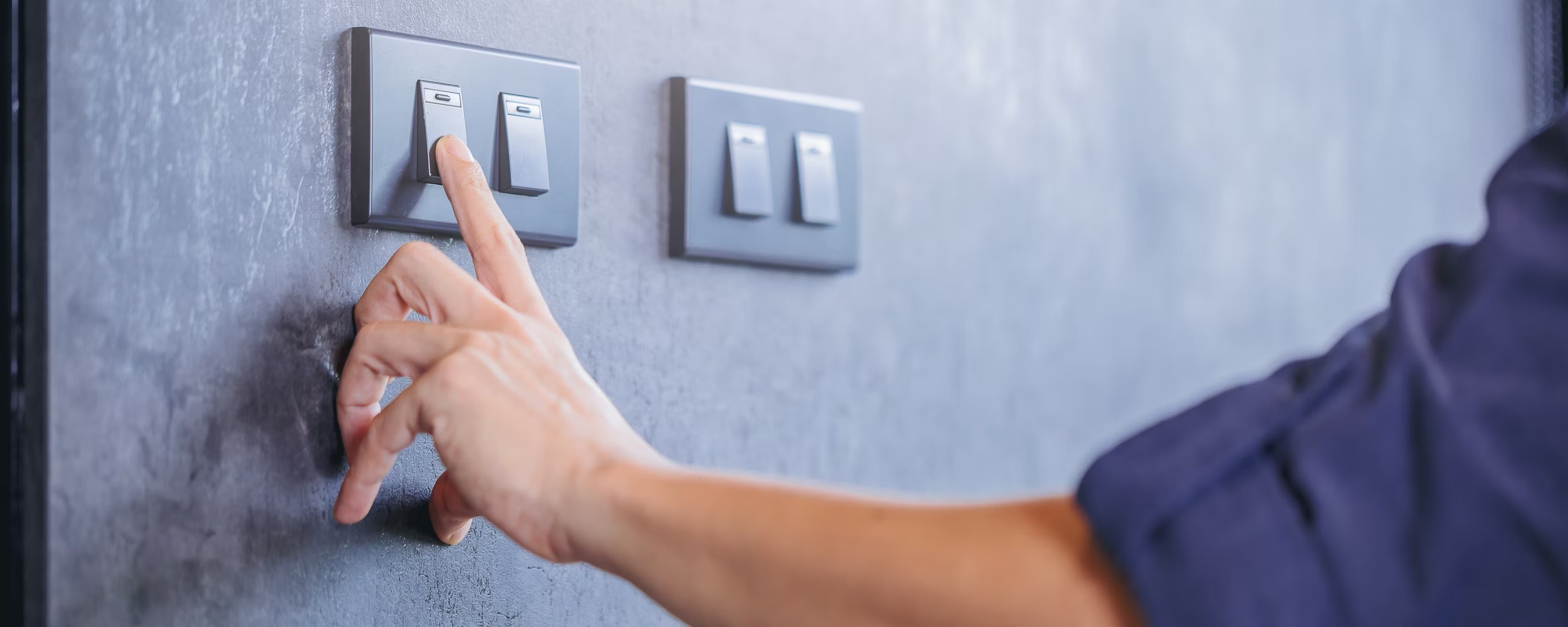 A person turning a switch on